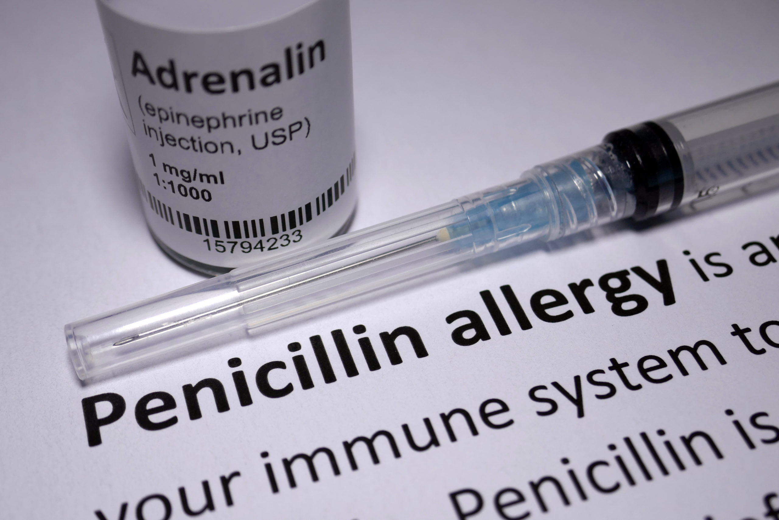 a prescription bottle with a needle and a note that says penicillin allergy